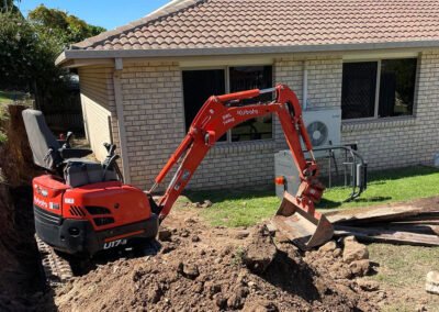 Excavator preparing site for construction
